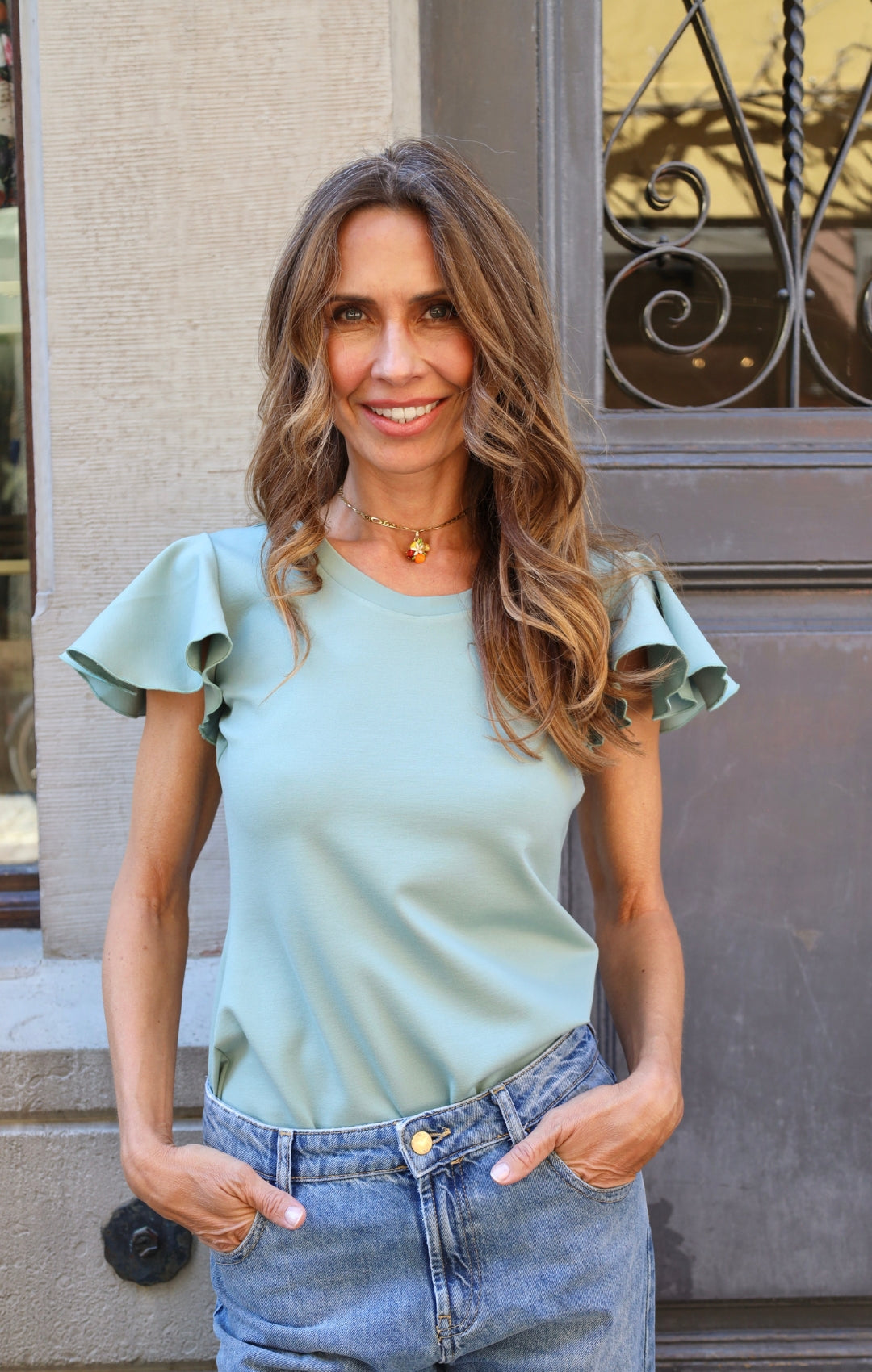 Top with flutter sleeves